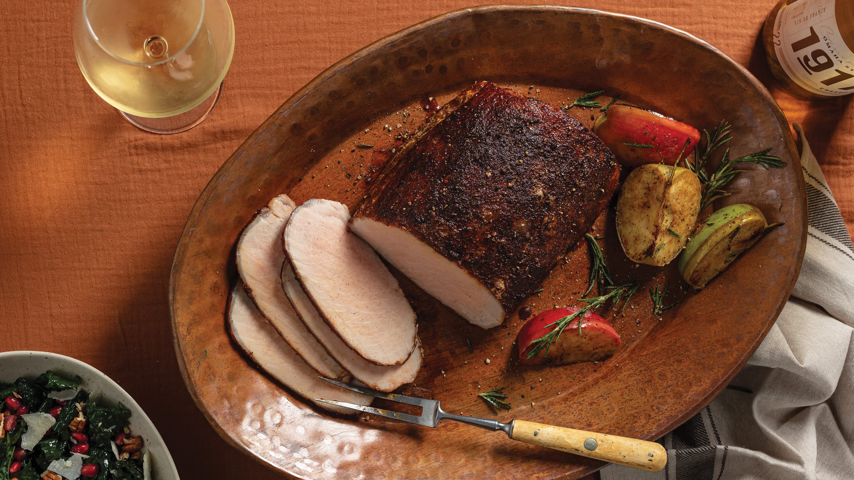 Pumpkin-spice smoked boneless pork loin sliced on platter