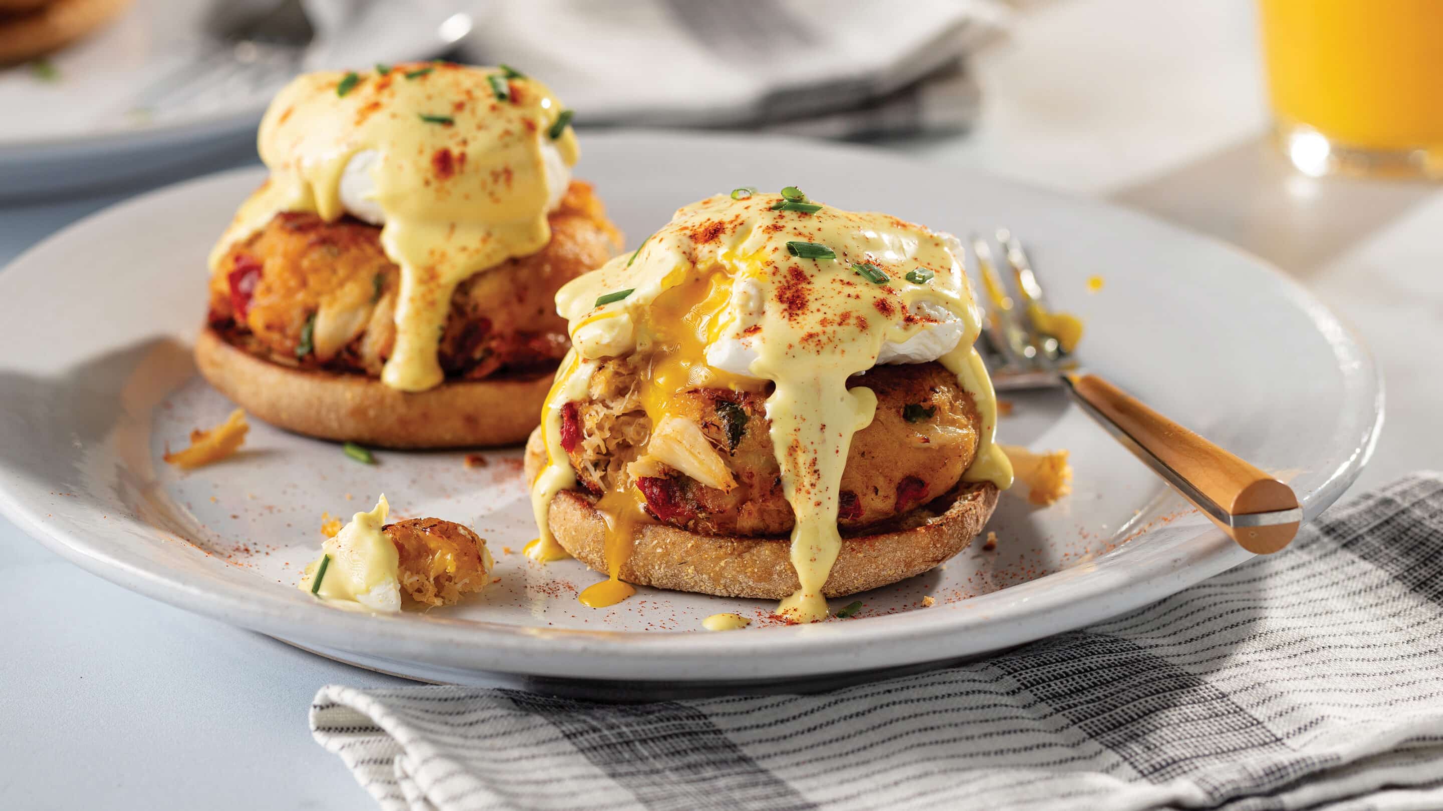 Crab Benedict with crab, egg, and hollandaise sauce on an English muffin