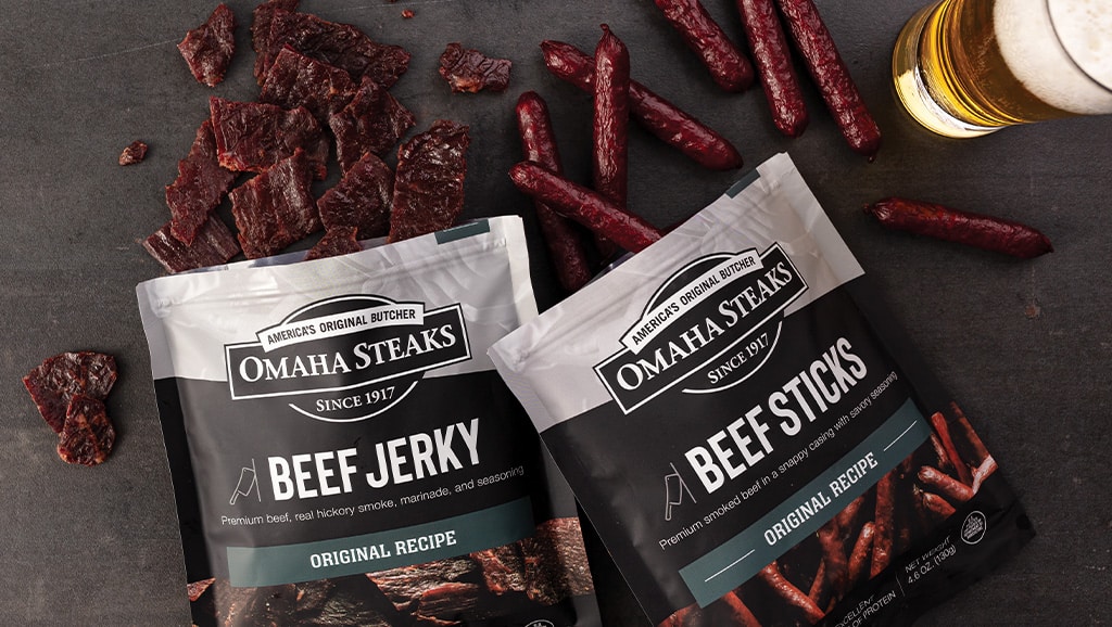 One bag of Omaha Steaks Beef jerky and one bag of Omaha Steaks Beef sticks opened with meat snacks. 