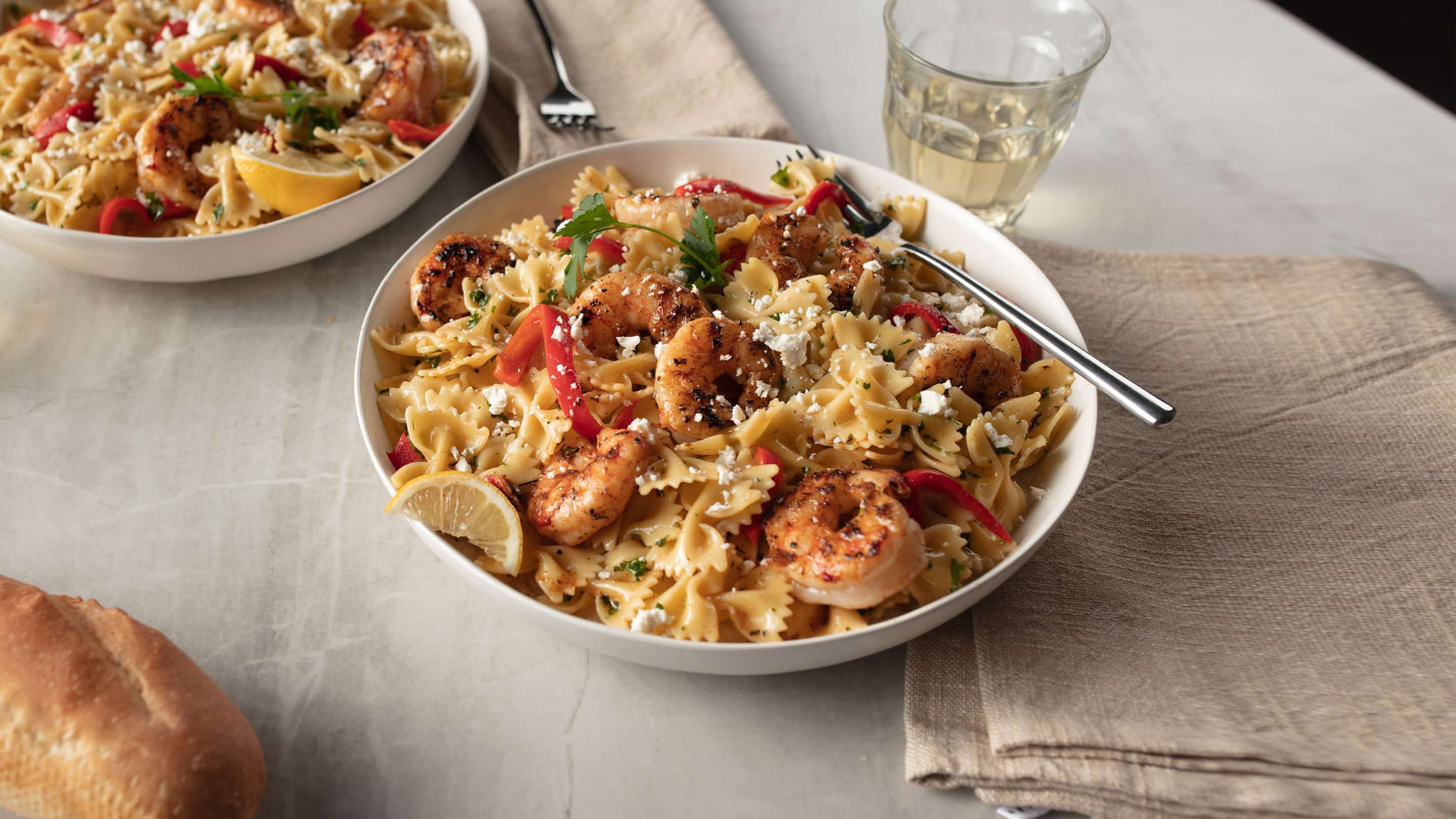 blackened shrimp pasta on white plate