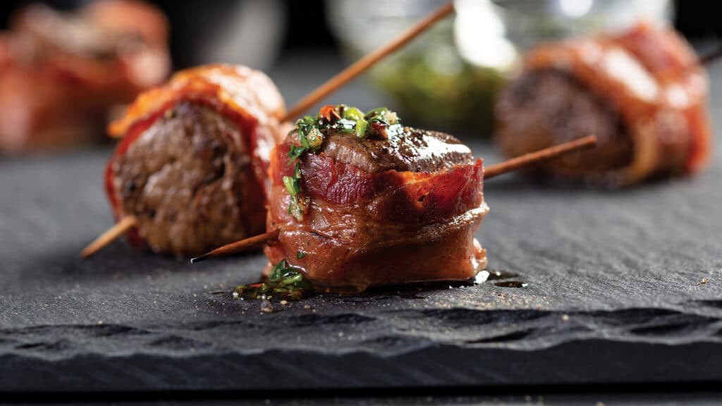 Bacon wrapped tenderloin tip appetizers on counter