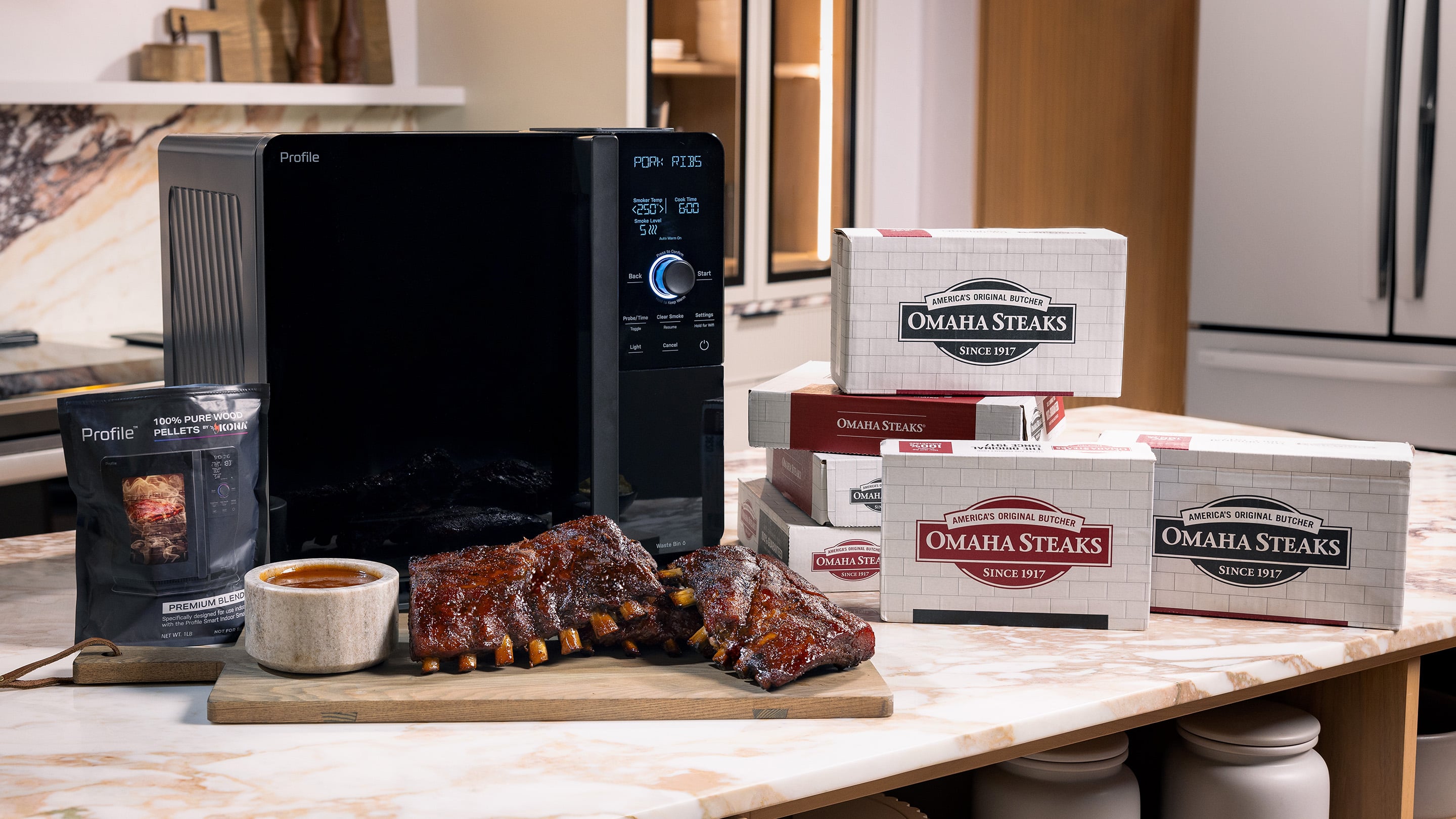 GE Profile Indoor Smoker on counter with smoked Omaha Steaks Baby back ribs