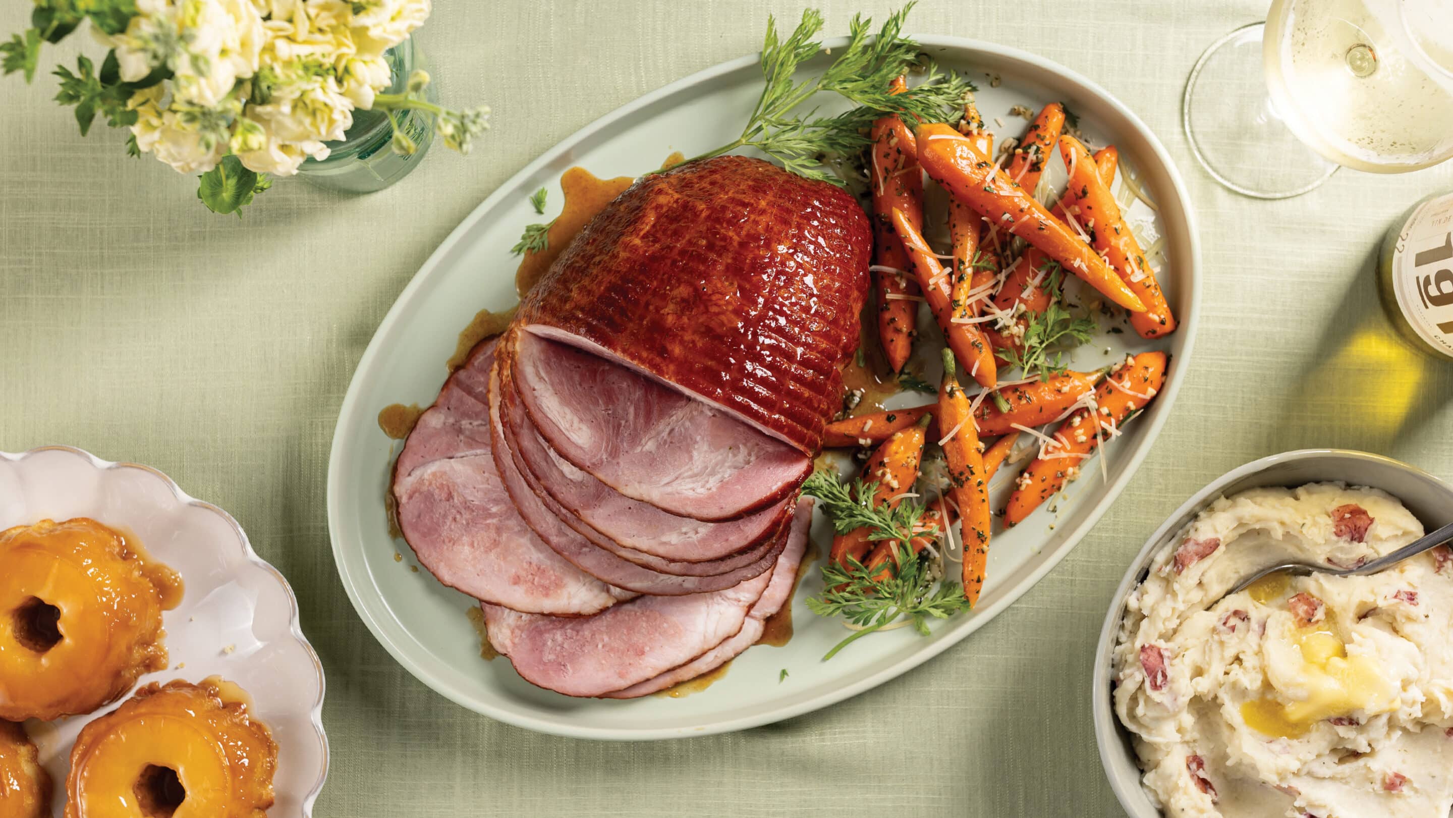 Easter dinner with Honey glazed ham, garlic parmesan carrots, and red smashed potatoes.